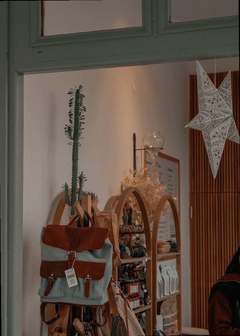 Chic boutique interior decor featuring backpacks and elegant wooden shelves.